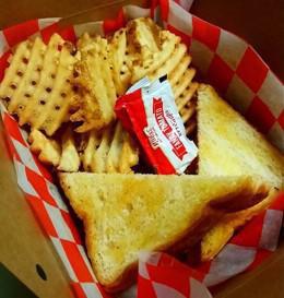 Kids Grilled Cheese · American cheese on texas toast, served with fries or chips.