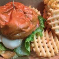 Buffalo Chicken Sandwich · Buffalo chicken strips served with lettuce, tomato and blue cheese or ranch dressing on a br...