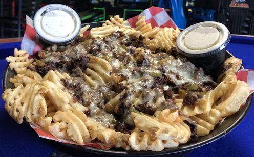 Teriyaki Cheesesteak Fries Platter · Waffle fries covered in Swiss cheese, grilled Philly meat, and sauteed bell peppers and onions, served with ranch & jalapeno.