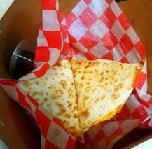 Kids Quesadilla · A grilled tortilla filled with cheddar, served with salsa.