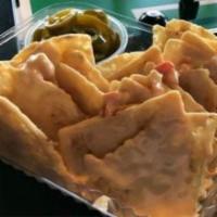 Stadium Nachos · Queso drizzled over tortilla chips with jalapenos or salsa served on the side.