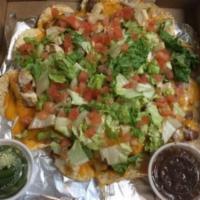Loaded Nachos · Refried beans, onions, cheddar & pepper jack, lettuce, tomato and your choice of chicken, sh...