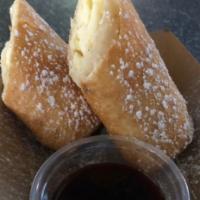 Cheesecake Chimichanga · Sprinkled with powdered sugar & served with raspberry chipotle dipping sauce.