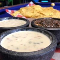 Chips & Queso Platter · Served with our homemade roasted salsa.