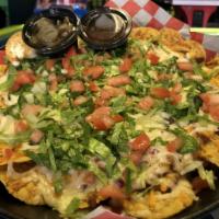Bean and Cheese Nachos · Refried beans, onions, cheddar & pepper jack, lettuce & tomato with jalapenos & salsa on the...