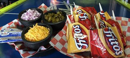 6 pack Walk-off Pies · Chili served up in bags of fritos with your choice of onion, cheddar and jalapenos.