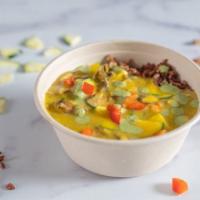 Flourish · Hot Coconut Curry soup poured over steamed red rice and quinoa, fresh spinach, and drizzled ...