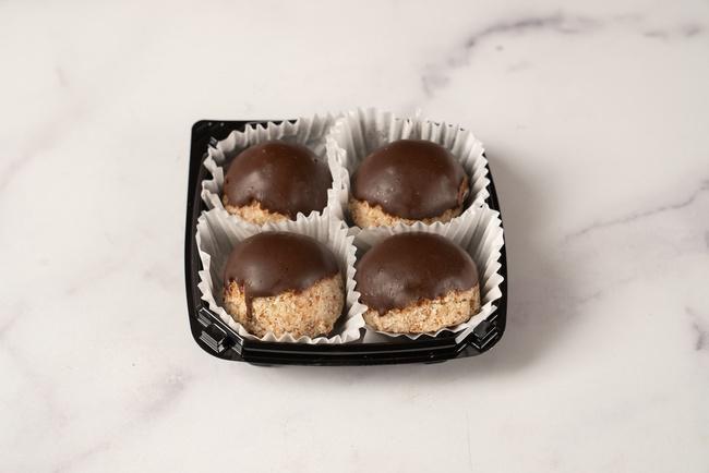 Raw Chocolate-Truffle Dipped Macaroon 4-Pack · A 4-pack of our exceptionally decadent, signature raw macaroons dipped in chocolate truffle are sure to hit the sweet spot! This pack includes two each of our vanilla and chocolate flavored macaroons.