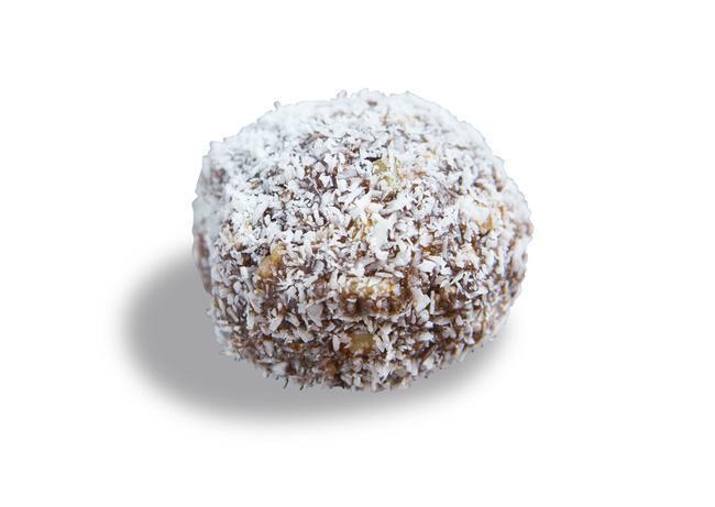 Single Raw Energy Orb · Tahini (sesame seeds), raw cacao, almond butter, sunflower seeds, agave, and vanilla extract rolled into a ball then rolled again in shredded coconut.