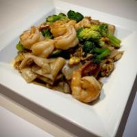 Pad See-Eiw	 · Stir fried thai style flat noodles with egg, broccoli,
and sweet brown sauce
