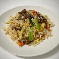 Thai Fried Rice · Stir-fried rice with egg ,bell pepper, onion, green onion, and carrots
in our homemade sauce

