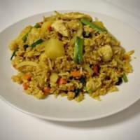 Pineapple Fried Rice · Stir-fried rice with egg, onion, carrots,
raisins, and pineapple in our homemade sauce with ...