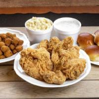 12 Piece Mixed Chicken Family Meal · Served with rolls, and two family side items.