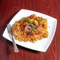 1. Chicken Biryani · Basmati rice with orange tikka chicken.
