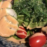 Goku Salad · Mixed green salad, tomato, cucumber, and miso dressing.