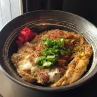 Katsu Don · Fried Pork cutlet, omlete and ginger shoyu sauce over rice.