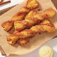 Cinnabon Stix® (10 ct) · Twisted fresh-baked Danish dough coated with buttery vanilla goodness and covered in sugar a...