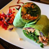Grilled Salmon Wrap · Blackened salmon, avocado spread, red onion, romaine and cherry tomatoes.