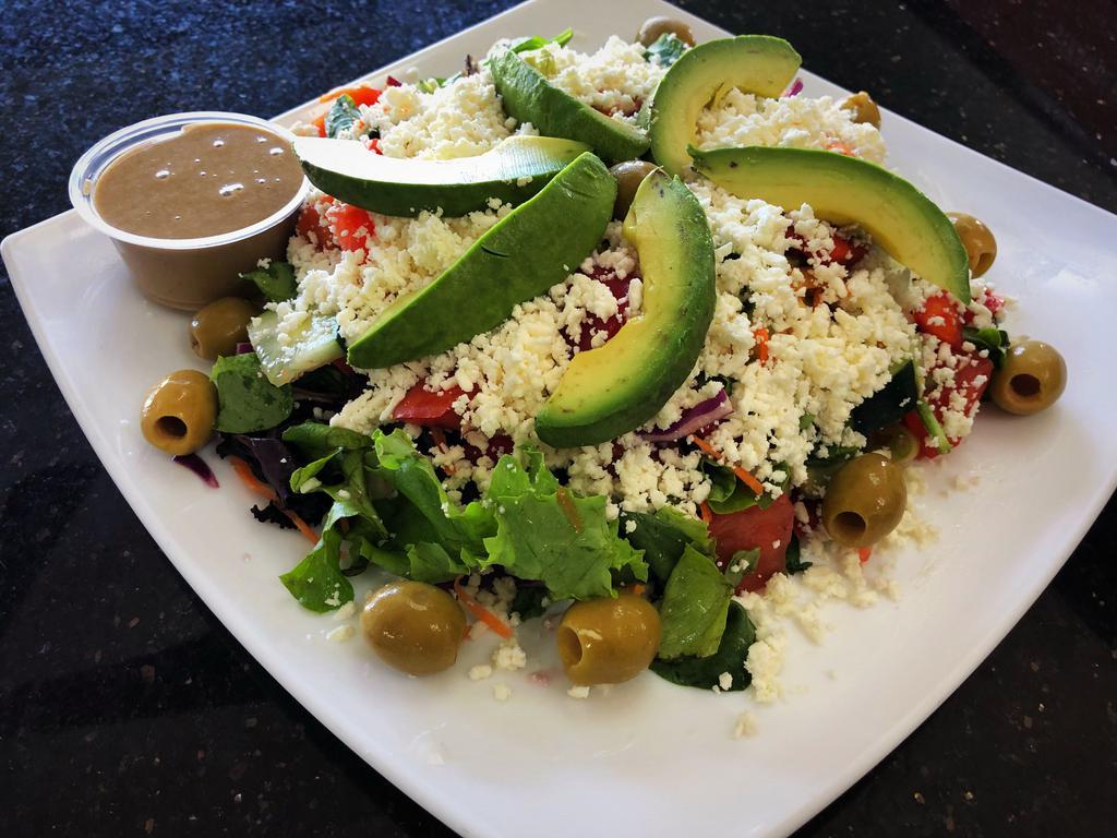 Garden Beauty Salad · Mixed greens, bell pepper, scallions, imported olives, avocado, red cabbage, grape tomatoes,
cucumbers, carrots, feta and tossed with light house dressing.