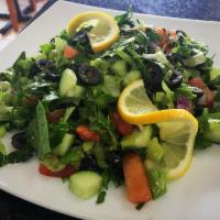 Real Mediterranean Salad · Fine chopped tomatoes, cucumbers, red onion, parsley, romaine lettuce tossed in lemon vinaig...