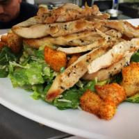 Chicken Caesar Salad · Grilled chicken, romaine lettuce, cherry tomatoes, shaved Parmesan cheese, tossed with homem...