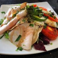 Turkey Caprese Salad · Fresh mozzarella, tomatoes, avocado, basil on a bed of mixed greens topped with turkey breas...