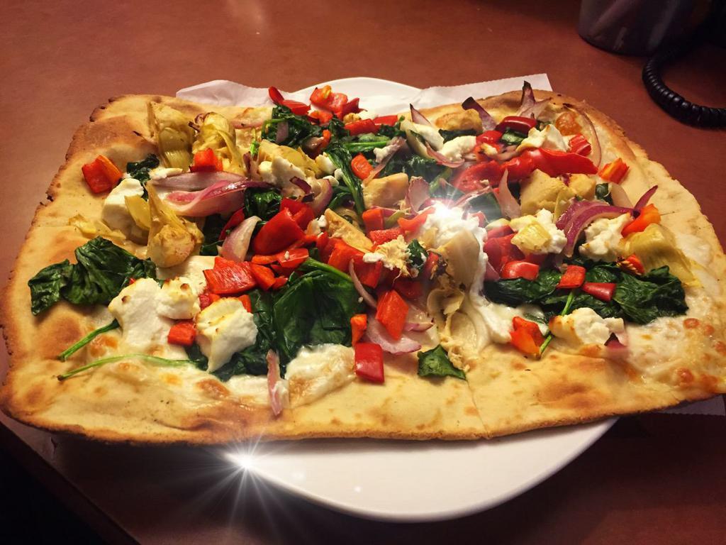 Gluten Free Spinach Flatbread · Spinach, roasted red peppers, artichokes, goat cheese and onions.