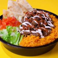 Halal Lamb over Rice · Served with soda.