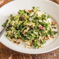Brussels and Kale · Bacon, almonds, Parmesan and maple tahini dressing.