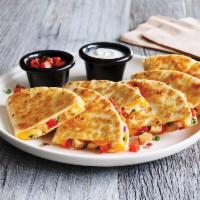 Chipotle Lime Chicken Quesadilla · Warm, grilled tortillas are loaded with chipotle lime chicken, fresh pico and a blend of mel...