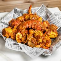Big Catch · 1/2 Lb Shrimp with head, 1/2 Clam and 7-8 Oz. Lobster tail

Served w/ Corn, Potato & Chick...