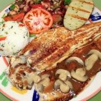 75. Trucha con Champinones · Trout with mushrooms sauce, rice, potato and salad.