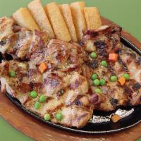 19. Churrasco de Pollo · Chicken churrasco, rice, salad and fried cassava.