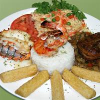 26. Mar y Tierra · Grilled rib eye steak with mushrooms sauce, lobster tail, shrimp, rice, cassava and salad.