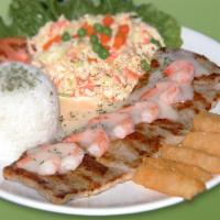 36. Lomo de Cerdo en Salsa con Camarones · Pork loin in diana or creole sauce with shrimp, rice, salad & fried cassava.