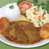 38. Lengua a la Criolla · Beef tongue a la creole, rice, salad and potato.