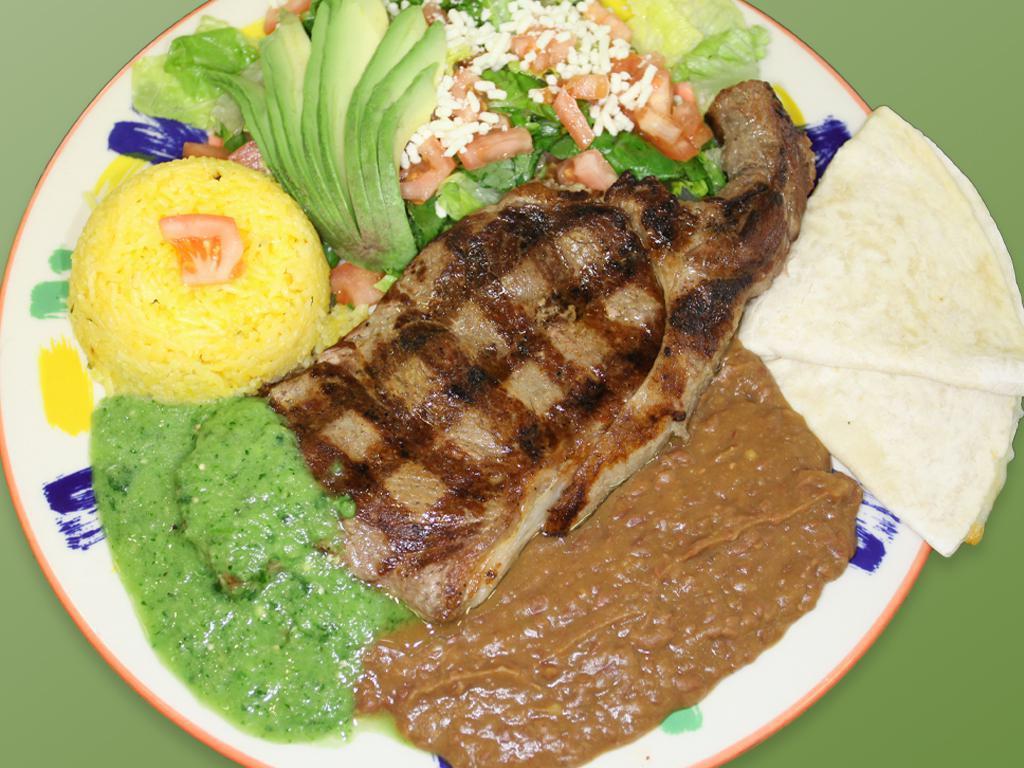 76. Churrasco Azteca · Grilled sirloin steak, yellow rice, salad & refried beans.