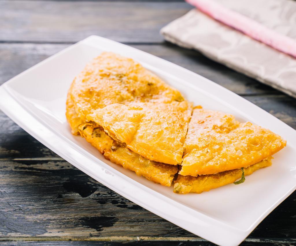 A7. Scallion Pancake 蔥油餅 · Savory folded flatbread. 