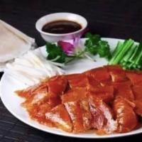 C2. Beijing Roast Duck 北京鸭 · crispy thin roasted duck served with spring onions, cucumber, sweet bean sauce, and Chinese ...