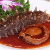 C6. Braised Premium Abalone(1pc) and Whole Sea Cucumber 紅燒鮑魚海參 · Served with asp in oyster sauce.
