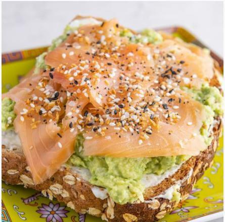 Avocado Lox Toast · Avocados mashed with Lemon juice, Himalayan Salt, Black Pepper, Red Pepper Flakes, Topped with Cream Cheese and Lox.