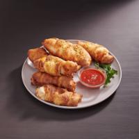 Pepperoni Rolls · Eight golden baked rolls stuffed with mozzarella and pepperoni. Served with a side of marina...