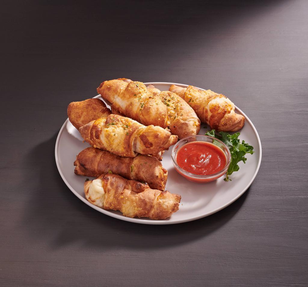 Pepperoni Rolls · Eight golden baked rolls stuffed with mozzarella and pepperoni. Served with a side of marinara dipping sauce.