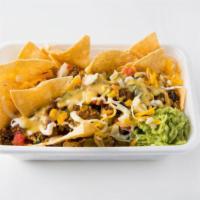 Nachos Bowl · Mound of fresh tortilla chips loaded with all your picks: rice, beans, meat, cheeses and mor...