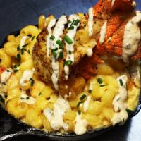 Fried Lobster Tail Mac n Cheese · Deep fried lobster tail over creamy 5 cheese smoked gouda Mac w/lobster meat.