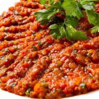8. Ezme · Finely chopped tomatoes, hot peppers, garlic and spice with olive oil and lemon juice.