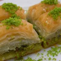 60. Baklava · Pastry with nuts, syrup and ground pistachio topping.