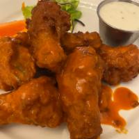 50 bone in wings · Served with celery and ranch dressing