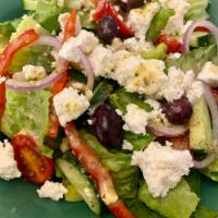 Greek Salad · Fresh crisp romaine, cherry tomato, cucumber, bell peppers, crumbled feta, red onion and Kal...