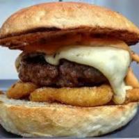Texas Cheeseburger Sandwich · Half Pound Angus burger with American cheese, Texas sauce and onion rings in a burger bun.